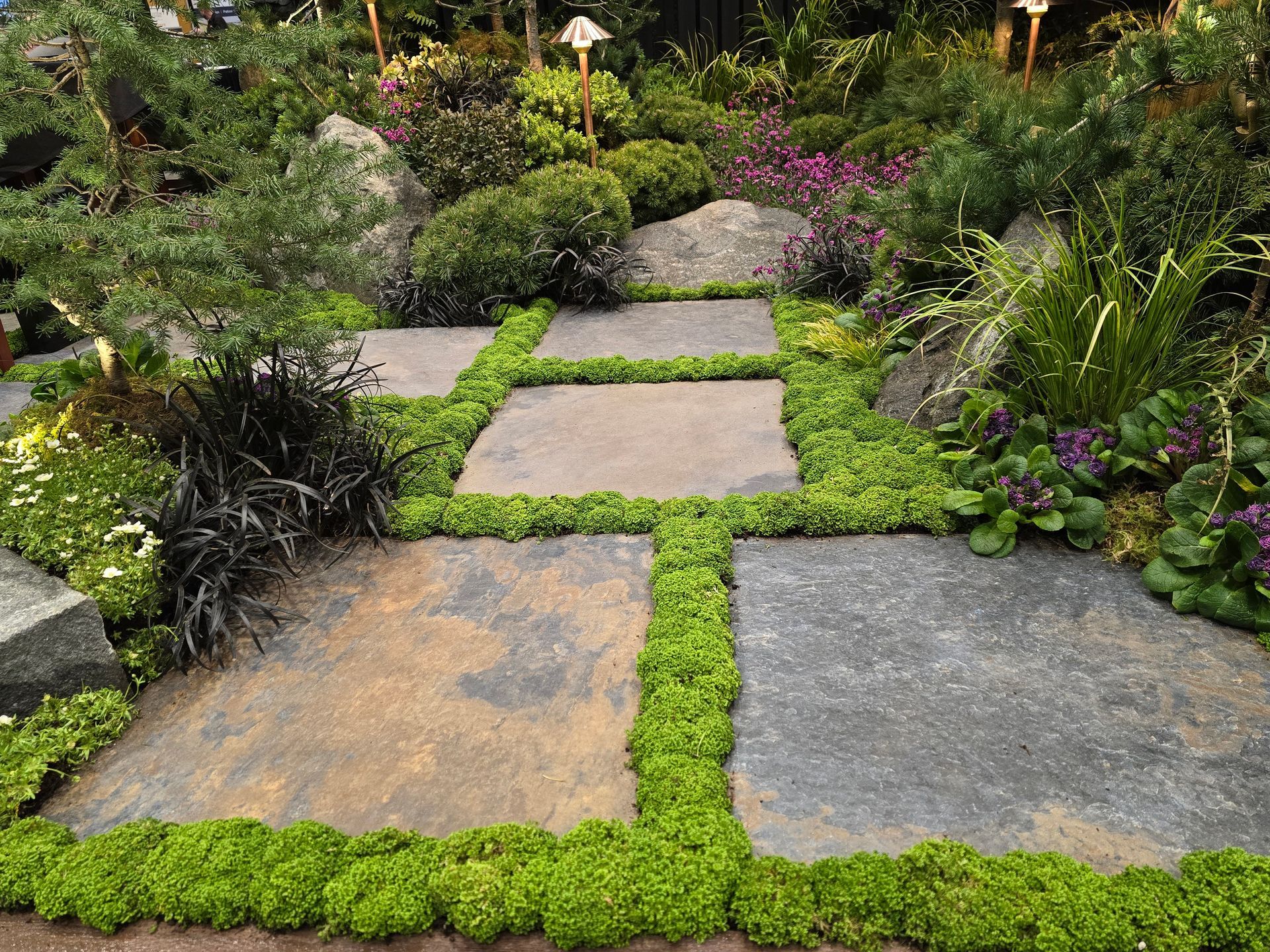 Luxury stone walkway with layered planting
